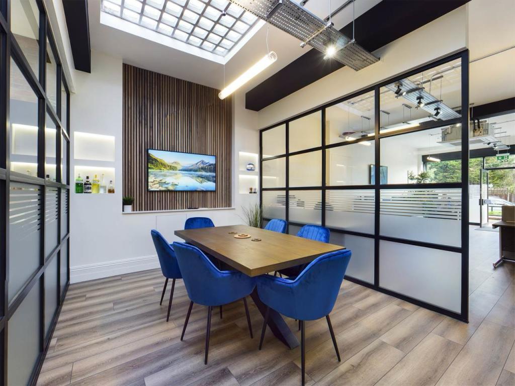 Office South London — glazed meeting room and open-plan workspace